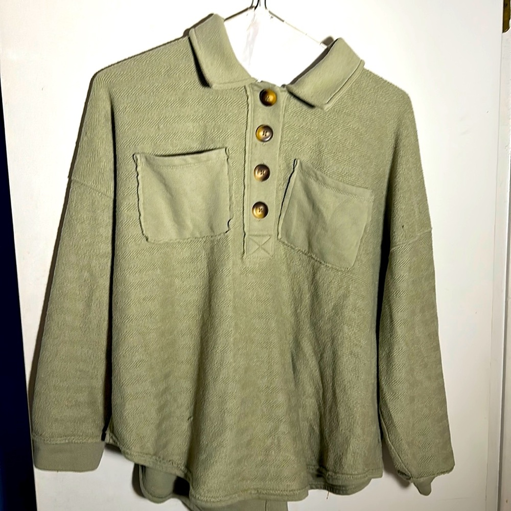 Khaki button sweater with towel-like feel.